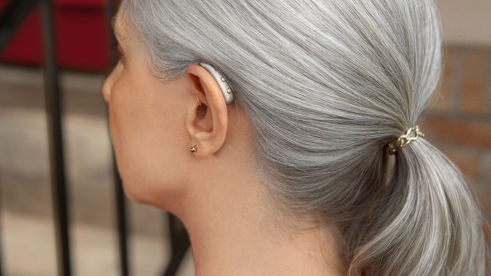 Close-up of the Signia Pure Charge&Go MaX hearing aid showing its discreet RIC design